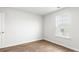 Bright bedroom offers durable laminate flooring and a window providing natural light at 131 River Hill Rd, Goose Creek, SC 29445