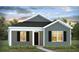 Charming single-story home with gray siding, black shutters, and well-manicured lawn, perfect for modern living at 131 River Hill Rd, Goose Creek, SC 29445