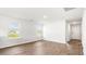 Bright living room with hardwood floors and large windows allowing ample natural light at 131 River Hill Rd, Goose Creek, SC 29445