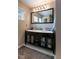 Double vanity in a bathroom with a large mirror and modern cabinets, complemented by a patterned floor at 1400 Harbor Mist Ct, Charleston, SC 29492