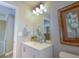 Bright bathroom features a modern vanity, a decorative mirror, and neutral wall color at 1400 Harbor Mist Ct, Charleston, SC 29492