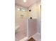Modern bathroom with shower that features tile flooring, built-in bench, and shower head at 1400 Harbor Mist Ct, Charleston, SC 29492