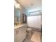 This bathroom features a sleek vanity, framed art, and a shower with stylish striped curtain at 1400 Harbor Mist Ct, Charleston, SC 29492
