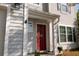 Close-up of a red front door with an anchor decoration and a 'Sweet Home' welcome mat at 1400 Harbor Mist Ct, Charleston, SC 29492