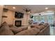 Cozy living room featuring a fireplace, recessed lighting, and a comfortable sectional sofa at 1400 Harbor Mist Ct, Charleston, SC 29492