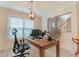 Bright office space with a wooden desk, plush rug, and a large window with natural light at 1400 Harbor Mist Ct, Charleston, SC 29492