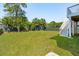Large backyard with lawn, privacy fence, and palm trees at 1479 Mossy Branch Way, Mount Pleasant, SC 29464