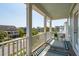Covered balcony with view of neighborhood and blue ceiling at 1479 Mossy Branch Way, Mount Pleasant, SC 29464