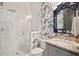 Bathroom featuring marble walk-in shower, decorative wallpaper, and elegant vanity with granite counters at 1479 Mossy Branch Way, Mount Pleasant, SC 29464
