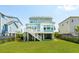Back exterior of home features a deck and yard at 1479 Mossy Branch Way, Mount Pleasant, SC 29464