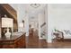 Elegant foyer with hardwood floors, decorative wallpaper, and staircase with white railings at 1479 Mossy Branch Way, Mount Pleasant, SC 29464