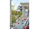 Relaxing front porch with comfortable chairs and a view of a tree-lined street at 1479 Mossy Branch Way, Mount Pleasant, SC 29464