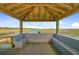 Inviting gazebo interior with built-in benches and scenic views of marshland at 1479 Mossy Branch Way, Mount Pleasant, SC 29464