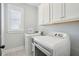 Clean laundry room with full-size washer and dryer at 1479 Mossy Branch Way, Mount Pleasant, SC 29464