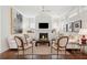 Bright living room with fireplace, built-in cabinets, and stylish furnishings at 1479 Mossy Branch Way, Mount Pleasant, SC 29464