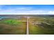 Aerial view of a long wooden boardwalk stretching across marshland under a blue sky at 1479 Mossy Branch Way, Mount Pleasant, SC 29464