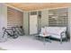 Cozy covered patio with comfortable seating, louvred walls, and bikes at 1479 Mossy Branch Way, Mount Pleasant, SC 29464