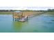 Picturesque pier gazebo with stairs to floating dock extending into marsh landscape at 1479 Mossy Branch Way, Mount Pleasant, SC 29464