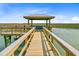 Scenic view from a wooden pier gazebo overlooking marshland and water at 1479 Mossy Branch Way, Mount Pleasant, SC 29464