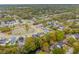 A captivating aerial shot displays an established residential neighborhood surrounded by lush trees and beautiful landscaping at 1529 Tomato Farm Cir, Mount Pleasant, SC 29464