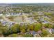 Beautiful aerial view of a low-density residential neighborhood surrounding a pond and lush green space at 1529 Tomato Farm Cir, Mount Pleasant, SC 29464