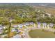 Scenic aerial view of a coastal community featuring charming homes and waterways in a lush landscape at 1529 Tomato Farm Cir, Mount Pleasant, SC 29464