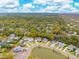 Breathtaking aerial view of a neighborhood with lush trees and a tranquil pond at 1529 Tomato Farm Cir, Mount Pleasant, SC 29464