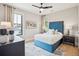 Comfortable bedroom with a blue headboard and chic accents at 1529 Tomato Farm Cir, Mount Pleasant, SC 29464