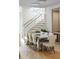 Elegant dining room featuring a large table, stylish chairs, and modern lighting at 1529 Tomato Farm Cir, Mount Pleasant, SC 29464