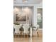 Close-up of the dining room showcasing designer lighting and a decorative wall feature at 1529 Tomato Farm Cir, Mount Pleasant, SC 29464