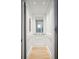 Interior of a sleek, modern elevator featuring white walls and light wood floors at 1529 Tomato Farm Cir, Mount Pleasant, SC 29464