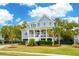 Inviting two-story home with a charming front porch and meticulously maintained landscaping at 1529 Tomato Farm Cir, Mount Pleasant, SC 29464