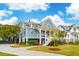 Attractive two-story home showcasing a spacious porch and professionally landscaped grounds at 1529 Tomato Farm Cir, Mount Pleasant, SC 29464