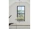 Hallway chandelier with black-trimmed windows offers neighborhood views and natural light at 1529 Tomato Farm Cir, Mount Pleasant, SC 29464