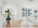 Hallway features white walls, light wood floors, and stylish railings at 1529 Tomato Farm Cir, Mount Pleasant, SC 29464