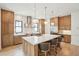 Modern kitchen featuring natural wood cabinetry, an island with seating, and stainless steel appliances at 1529 Tomato Farm Cir, Mount Pleasant, SC 29464