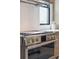 Close up of stainless steel gas range with modern knobs and tile backsplash in kitchen at 1529 Tomato Farm Cir, Mount Pleasant, SC 29464