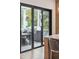 View of outdoor patio from kitchen featuring sliding glass doors, grill, and table at 1529 Tomato Farm Cir, Mount Pleasant, SC 29464