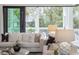 Bright living room featuring comfortable sofas, stylish decor, and large glass doors to the outside at 1529 Tomato Farm Cir, Mount Pleasant, SC 29464