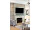 Inviting living room features a modern fireplace, a wall-mounted TV, and stylish decor at 1529 Tomato Farm Cir, Mount Pleasant, SC 29464
