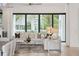 Spacious living room showcasing comfortable seating, modern decor, and a seamless connection to outdoor views at 1529 Tomato Farm Cir, Mount Pleasant, SC 29464