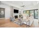 Inviting living room featuring a fireplace, TV, comfortable seating, and abundant natural light at 1529 Tomato Farm Cir, Mount Pleasant, SC 29464