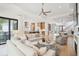 Open-concept living room with hardwood floors, comfortable sofas, and a modern design at 1529 Tomato Farm Cir, Mount Pleasant, SC 29464