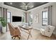 Bright office with neutral colors, wood floors, ceiling fan, and ample natural light at 1529 Tomato Farm Cir, Mount Pleasant, SC 29464