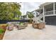 A cozy outdoor patio features comfortable seating and dining furniture with pavers at 1529 Tomato Farm Cir, Mount Pleasant, SC 29464
