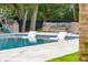 A tranquil pool with sun loungers in the water invites relaxation at 1529 Tomato Farm Cir, Mount Pleasant, SC 29464