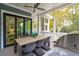 Covered patio features a large dining table, chairs, and built-in grill at 1529 Tomato Farm Cir, Mount Pleasant, SC 29464