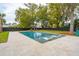 An in-ground pool with lounge chairs and a patio create an outdoor oasis at 1529 Tomato Farm Cir, Mount Pleasant, SC 29464