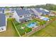 Backyard aerial view featuring a swimming pool, patio area, and manicured lawn is great for outdoor living at 158 Garden Lily Ln, Summerville, SC 29485