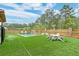 Private backyard features a swimming pool, manicured lawn and patio area for entertaining with Gathering and friends at 158 Garden Lily Ln, Summerville, SC 29485